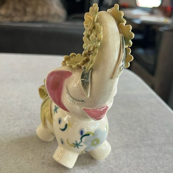 A decorated Elephant? Ceramic. Pink ears. Nose in air. Flowers on trunk. Eyelash - Picture 7 of 14